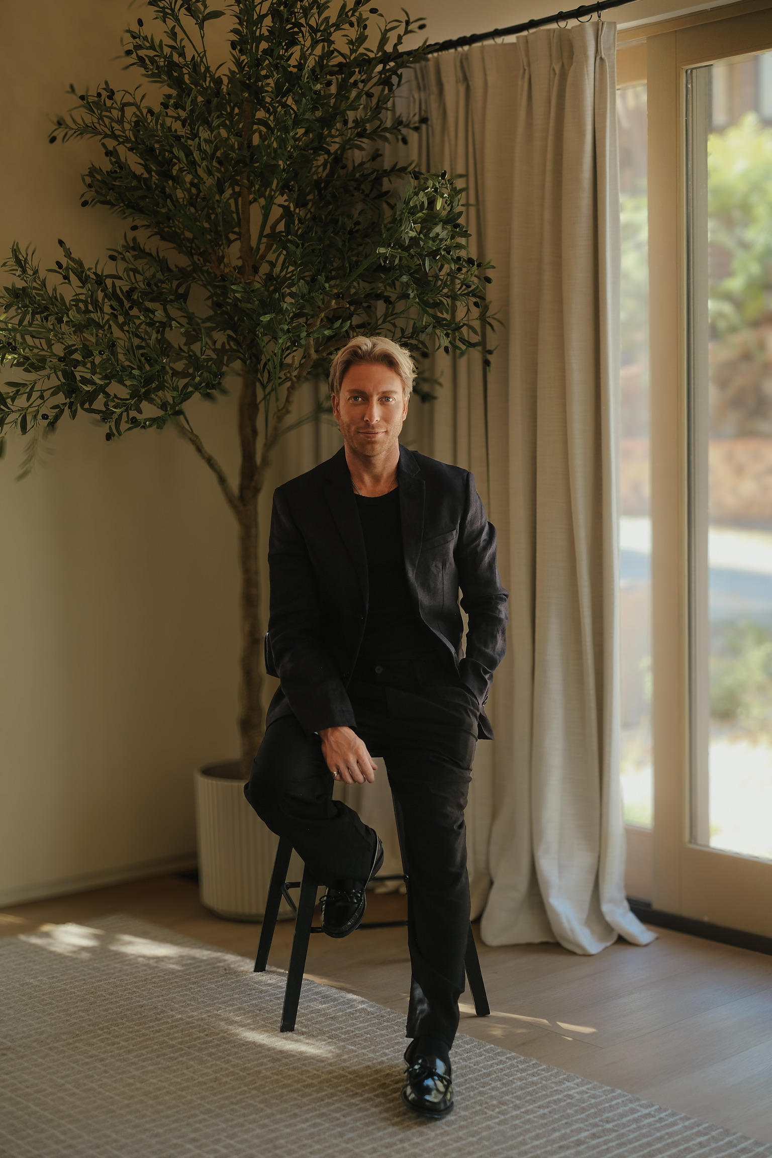 Matthew Hoult seated inside a Los Angeles residence